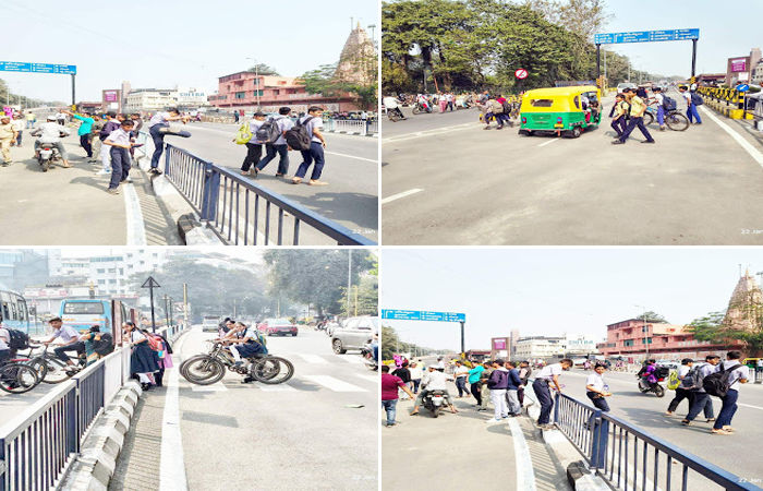 સુરત પાલિકાના અણઘડ આયોજનથી વિદ્યાર્થીઓના જીવ જોખમમાં : એક બાજૂ લોકાપર્ણ અને બીજી બાજુ સ્કુલના વિદ્યાર્થીઓનું રેલીંગ કુદી શાળાએ પહોંચ્યા 1 - image