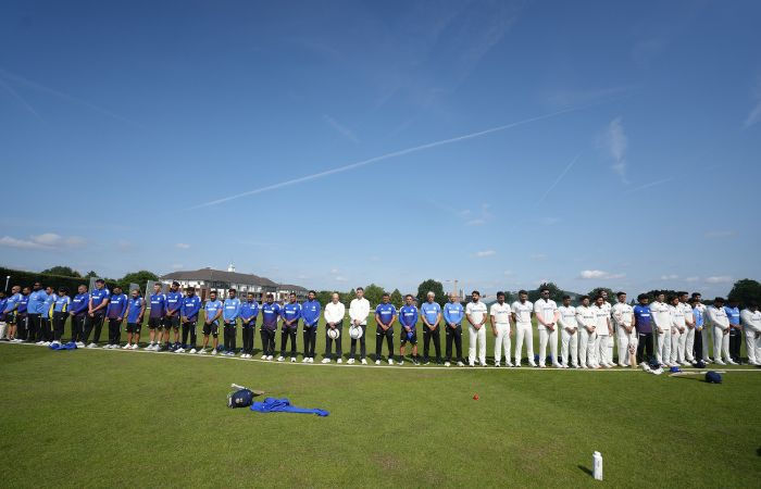 Players in England wear black armbands observe a minute's silence in memory of Ahmedabad plane crash victims