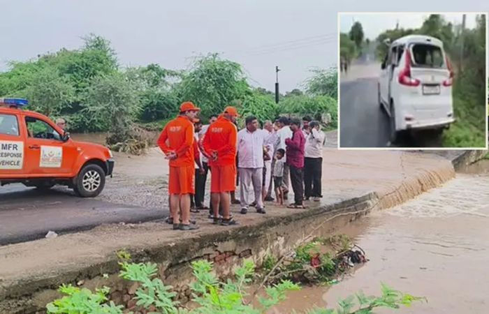 Two BAPS monks die after car sweeps away by water accumulated on causeway near Botad