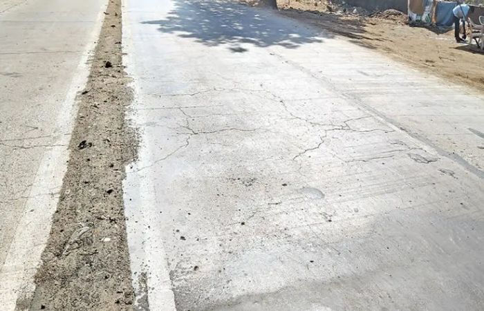 Vejalpur residents irked as water from leaking pipeline flows onto RCC road AMC rejects digging