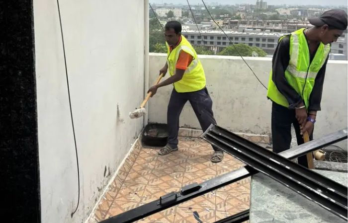 AMC begins demolition of illegal nine-storey building near Astodia Darwaja