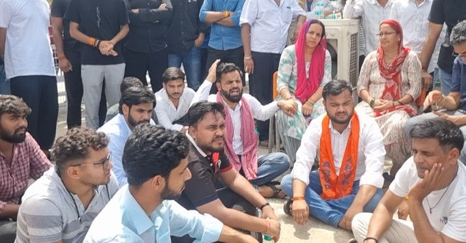 Sharda University case Family students protest against faculty two arrested
